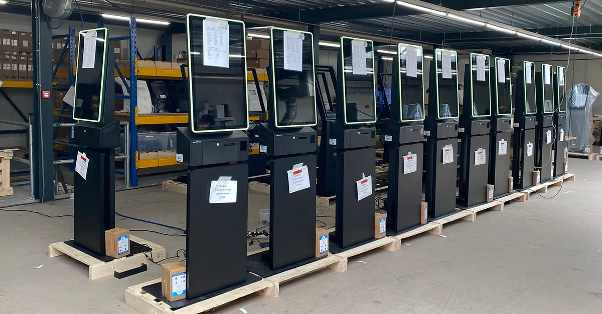 HANOS SHOP order kiosk in the production hall, designed and supplied by Prestop, with customized poster plate and integrated software.