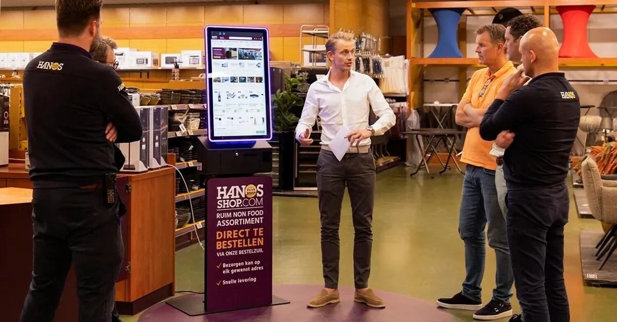 HANOS SHOP order kiosk in a branch, designed and supplied by Prestop, with custom poster plate and integrated software.