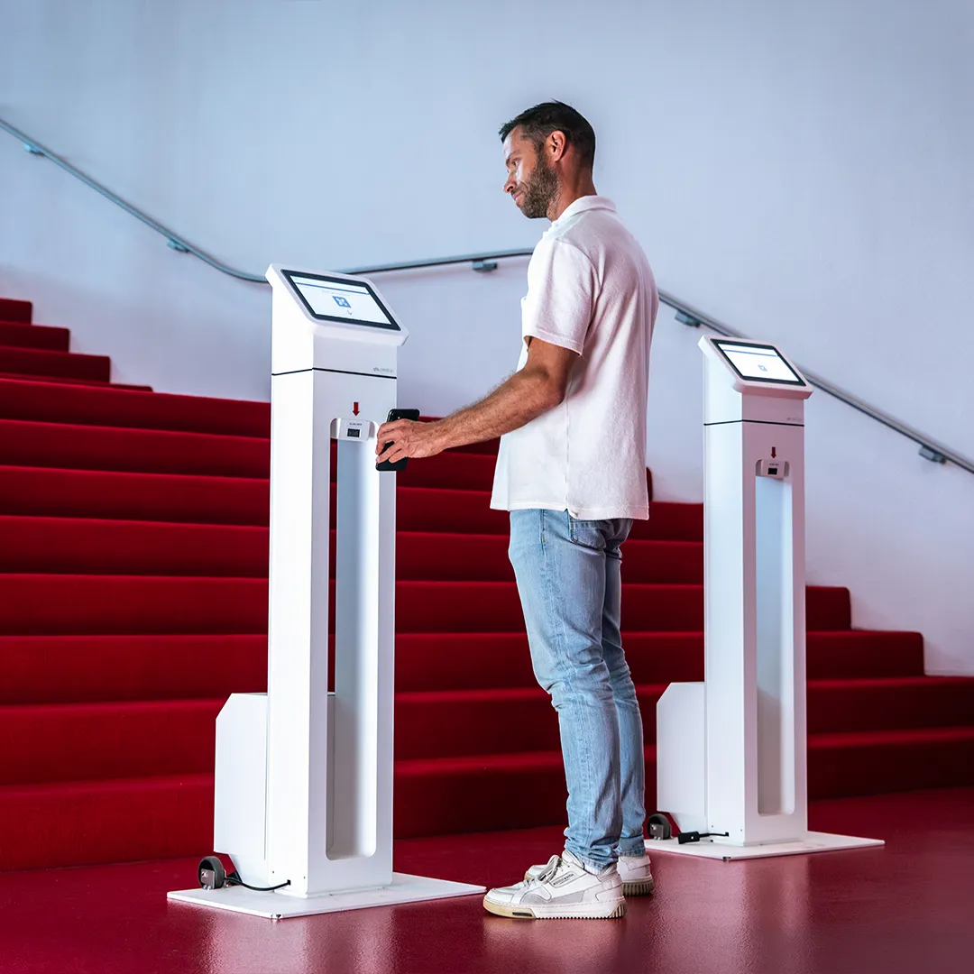Man scans phone on kiosk close-up