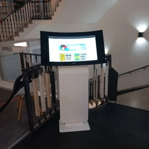 Libris Bookstore in Hilversum shows offerings on curved display occasion kiosk